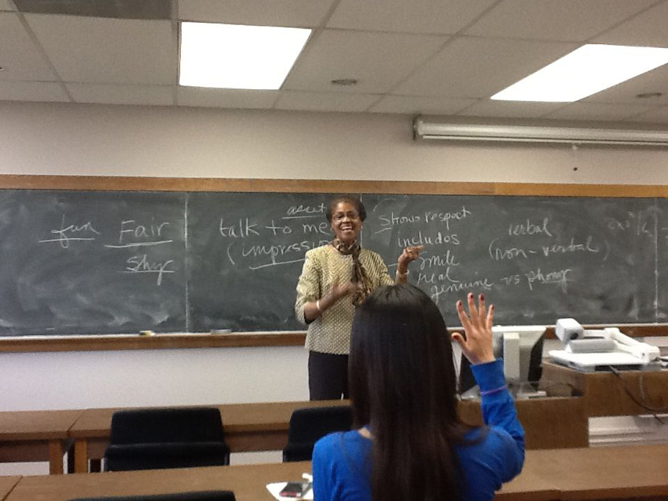 Barbara Ballard talking in front of chalk board