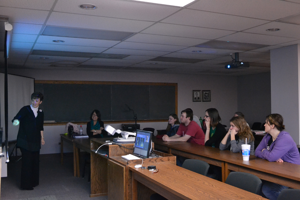 Boy smiling while looking behind his shoulder