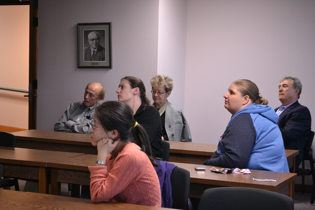 Class looking on to speaker in front of class