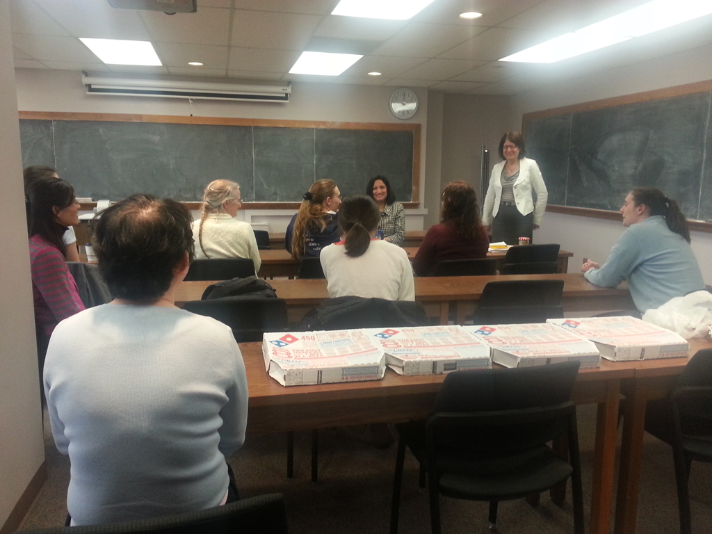 Bozenna standing at front of class having discussion